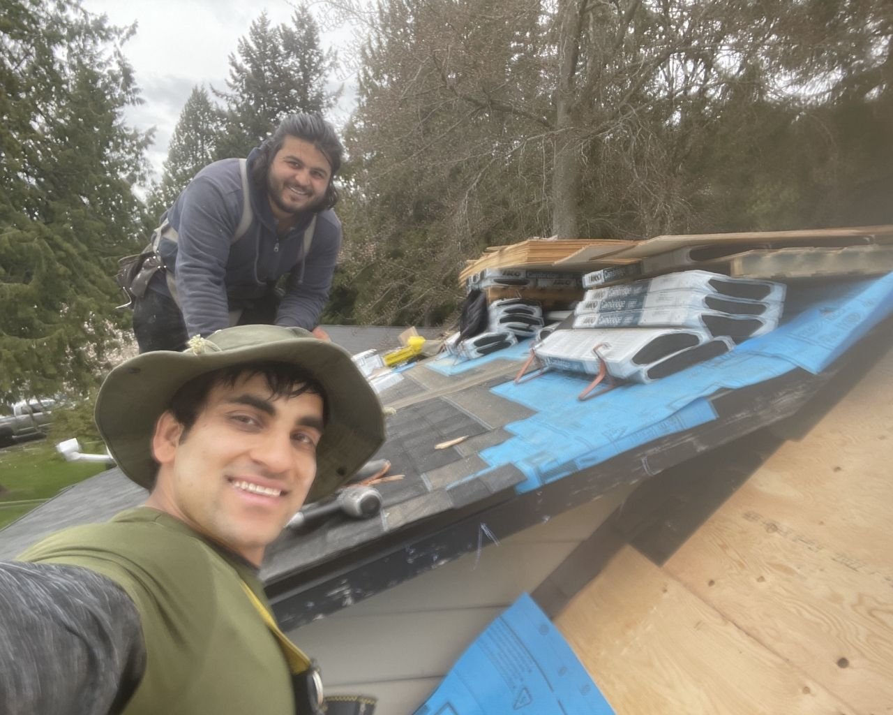 Scarlet Roofing & Gutters crew on a residential job site in Vancouver, BC