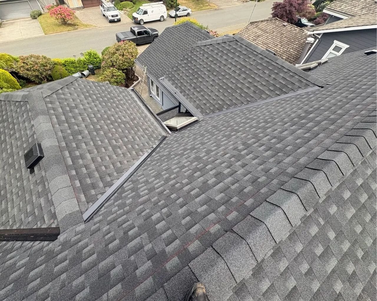 Scarlet Roofing crew inspecting a residential roof in Vancouver