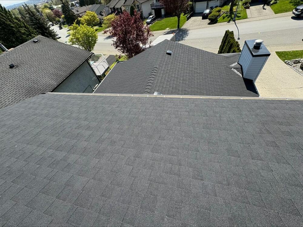 Close-up of a new seamless gutter and downspout installation in Coquitlam, BC