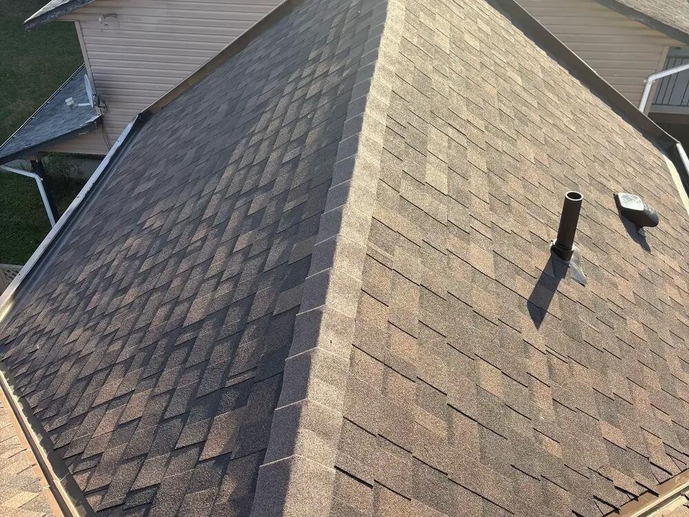 Finished roof replacement with new grey architectural shingles on a Vancouver home