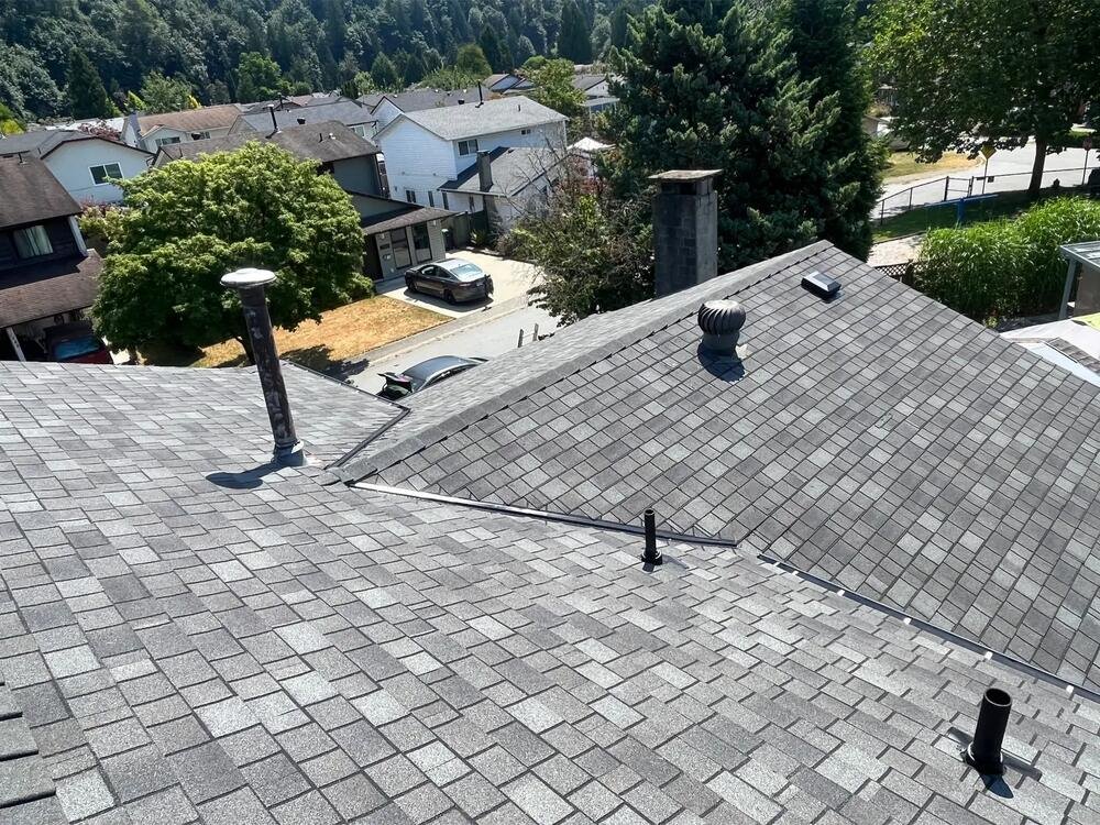 Roof tear-off in progress after storm damage on a home in Maple Ridge, BC