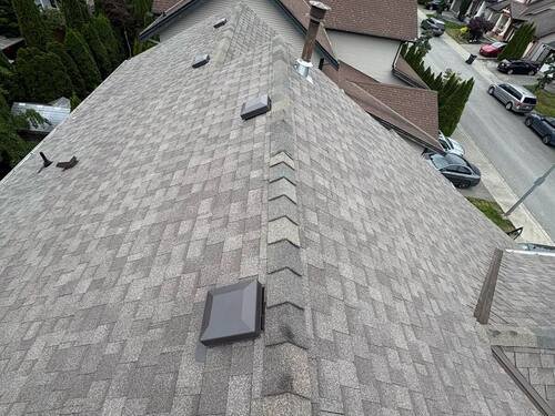 Flat Roof Torch-On — Torching the modified-bitumen membrane down at the roof edge.