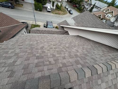 Full Roof Replacement — New architectural shingles running the full length of the main slope.