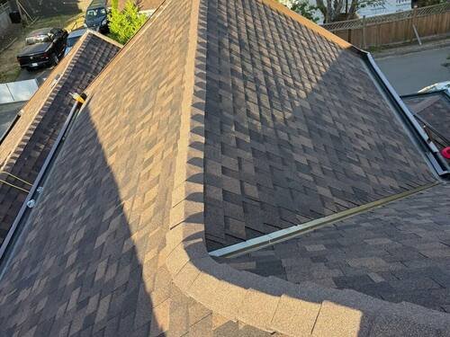 Full Roof Replacement — Hip and valley detail on the finished shingle roof.