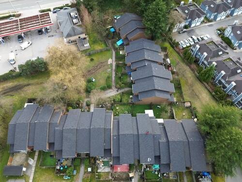 Full Roof Replacement — Drone view of the full property and the completed roofline.