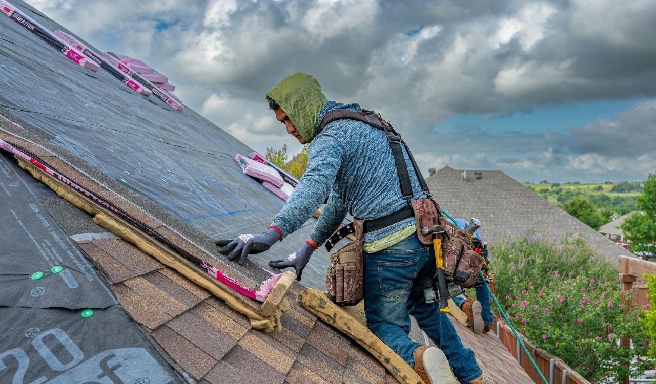 Close-up shingle and flashing repair by Scarlet Roofing & Gutters