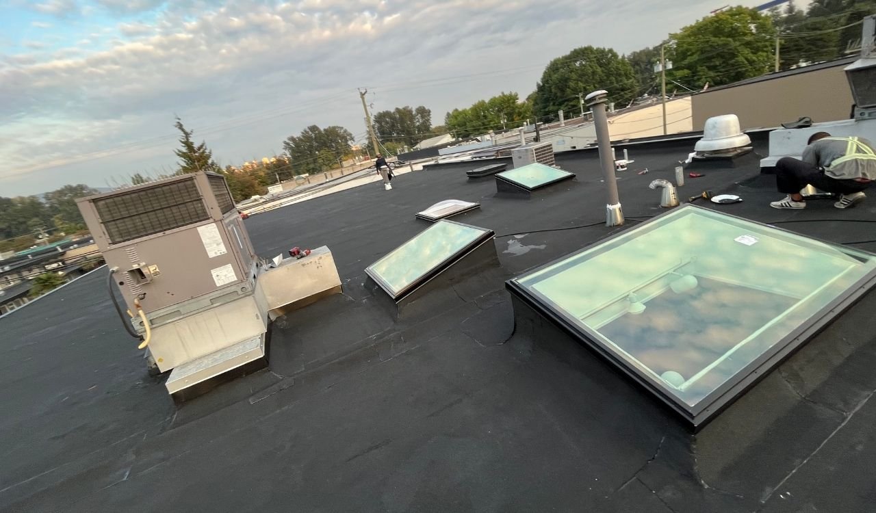 Torch-on flat roof membrane installation by Scarlet Roofing & Gutters